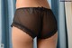 A close up of a woman's butt in a black panties.